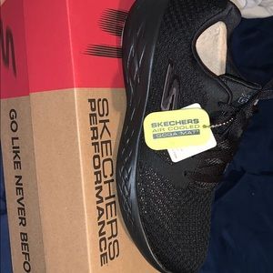 Black Skechers running shoes